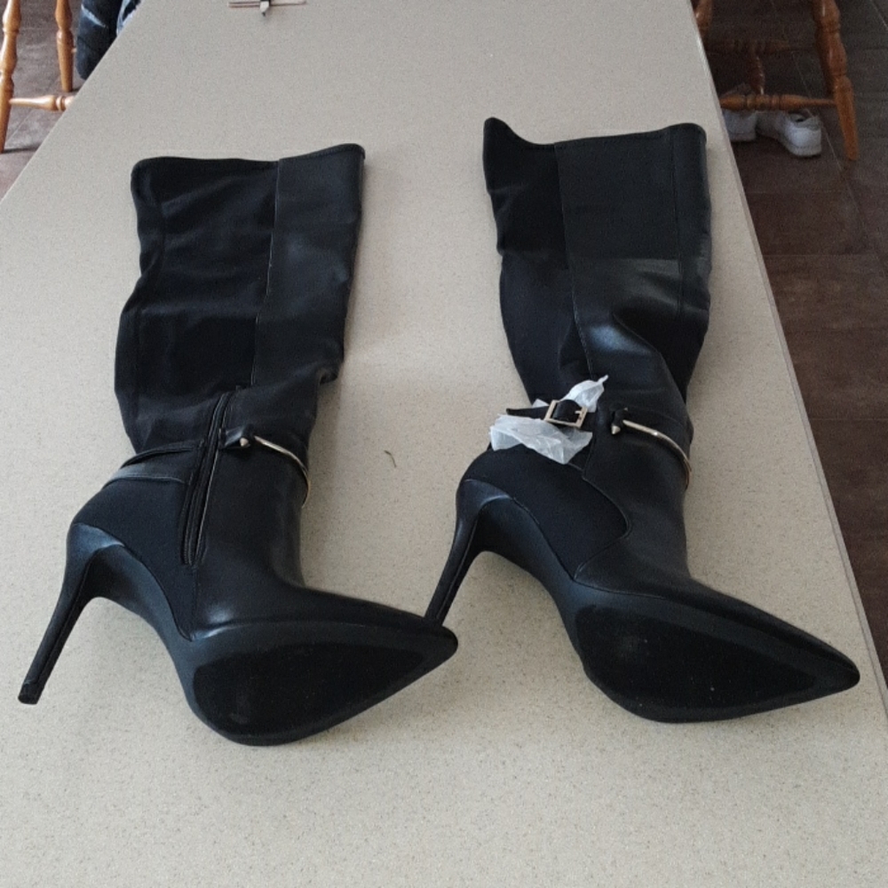 Knee length black stiletto boot